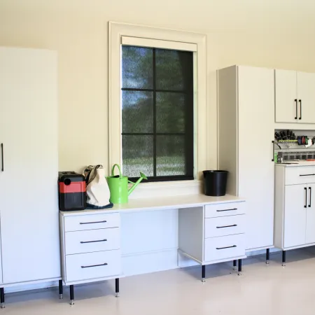 a kitchen with white cabinets