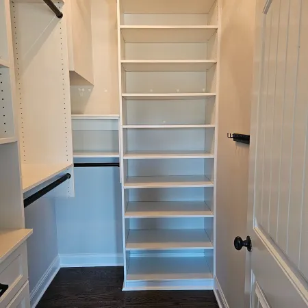 a room with white cabinets