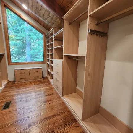 a room with a wood floor and a window