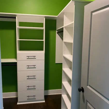 a white cabinet with drawers