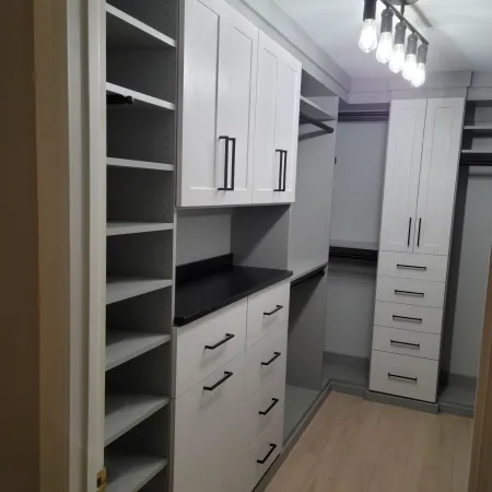 a white kitchen with white cabinets