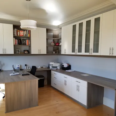 a kitchen with white cabinets