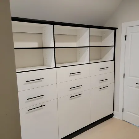 a white cabinet with drawers