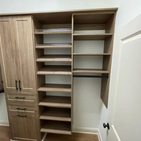 a room with shelves and a door