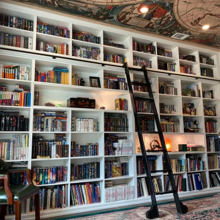 a shelf with many books on it