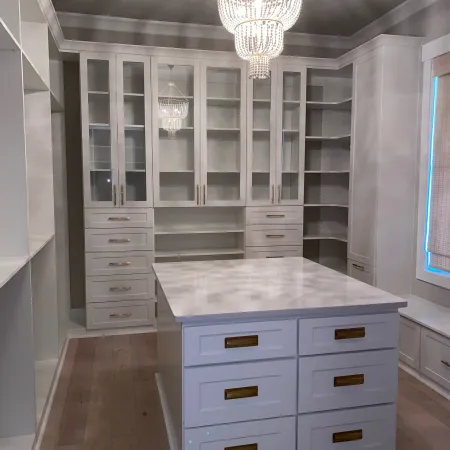 a kitchen with white cabinets