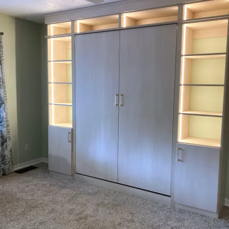 a room with a shelf and a light