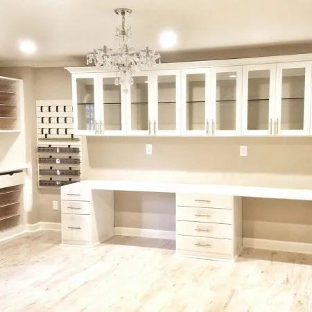 a kitchen with white cabinets