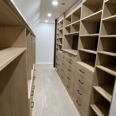 a room with shelves and a wood floor