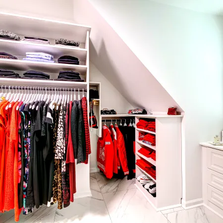 a closet with clothes and clothes