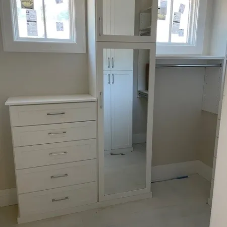 a white cabinet in a room