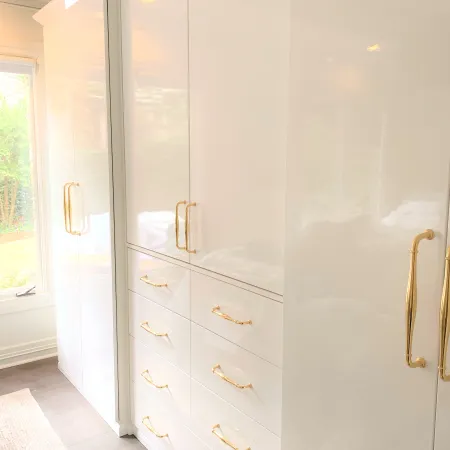 a white cabinet with a glass door