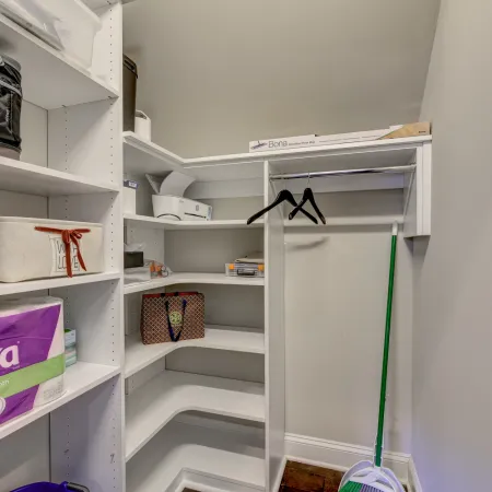 a white shelf with objects on it