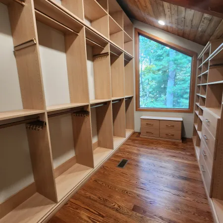 a room with a wood floor and a window