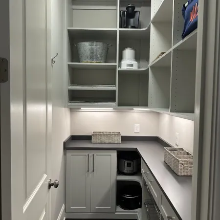 a kitchen with white cabinets