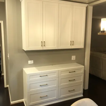 a white cabinet with drawers