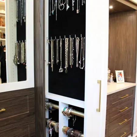 a black cabinet with a door open