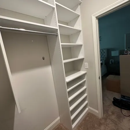 a white closet in a room