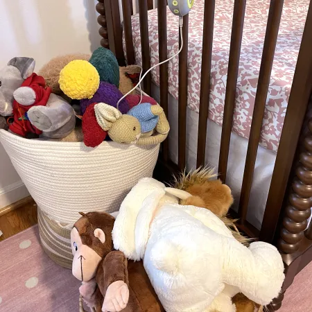 stuffed animals in a crib