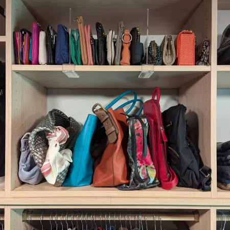 a shelf with clothes and shoes on it