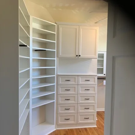 a white cabinet with drawers