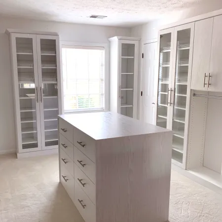 a white kitchen with white cabinets