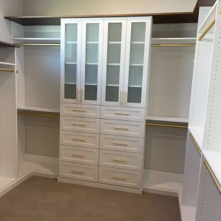 a white cabinet with white drawers