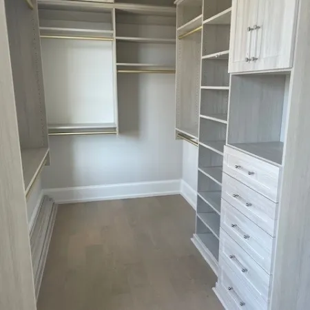 a room with white cabinets