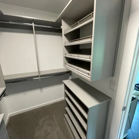 a room with shelves and a door