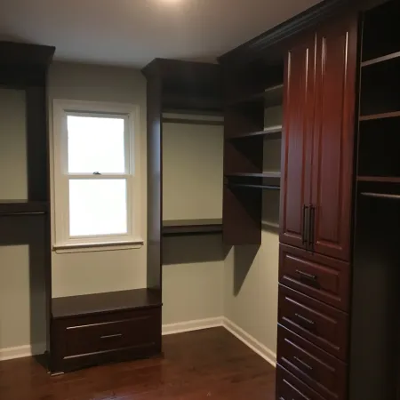 a room with a window and shelves