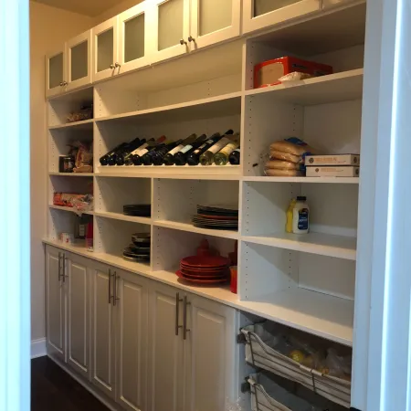 a white refrigerator with many bottles