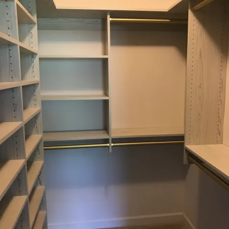 a room with shelves and a door