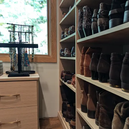 a room with shelves of shoes