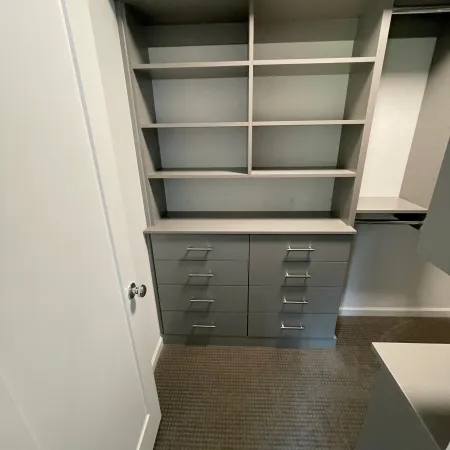 a white cabinet with drawers