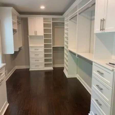 a kitchen with white cabinets