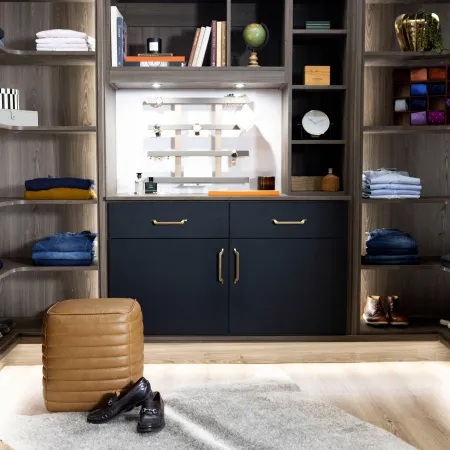 a closet with a blue cabinet and shelves