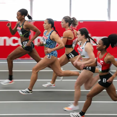 a group of women running on a track