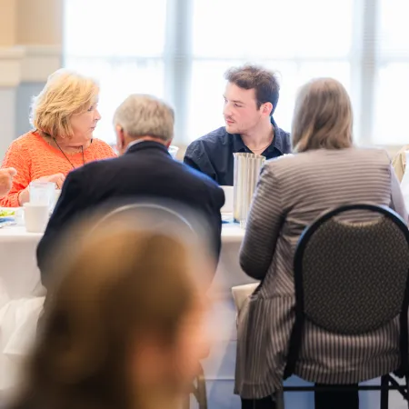 a group of people sitting at a table