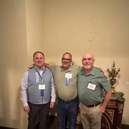 a group of men posing for a photo