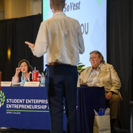Young man presenting to judges at Berry College Student Enterprise Entrepreneurship competition.