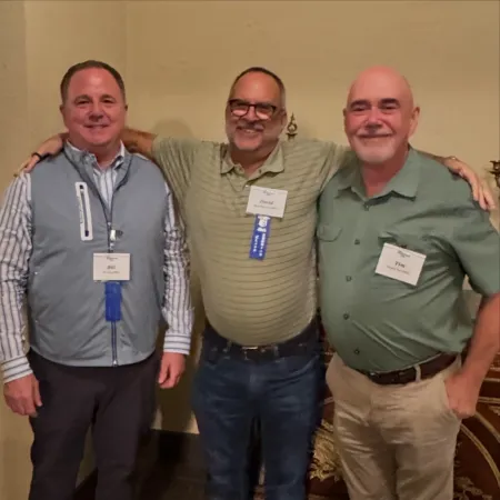 a group of men posing for a photo