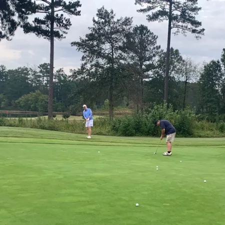 a group of people playing golf