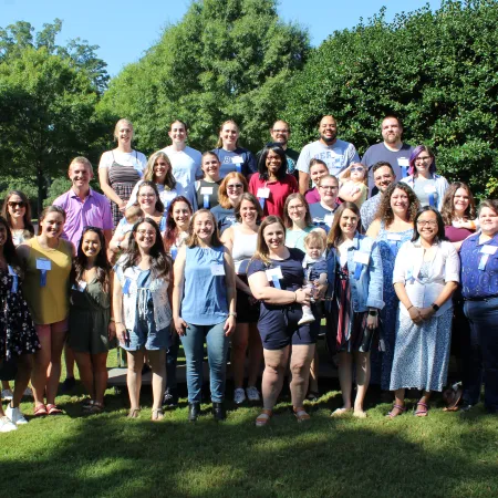 a group of people posing for a photo