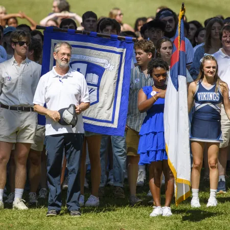 a group of people holding flags