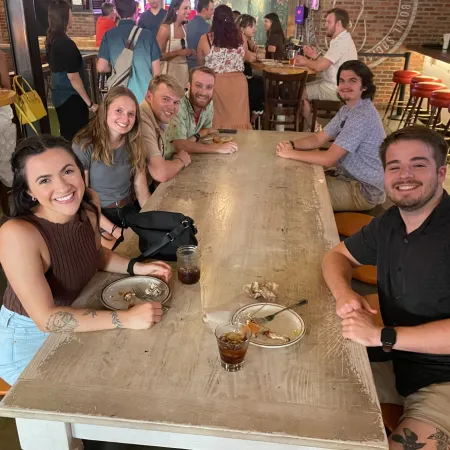 a group of people sitting at a table