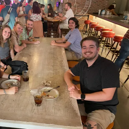 a group of people sitting at a table