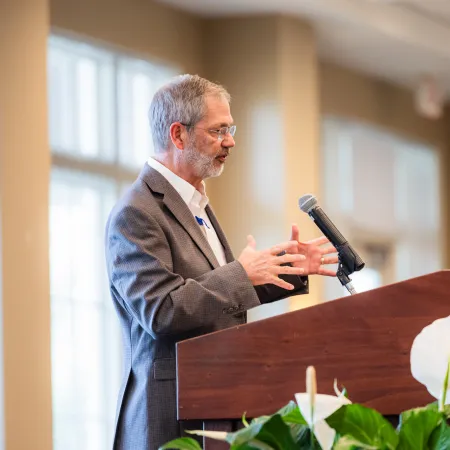 a man speaking into a microphone