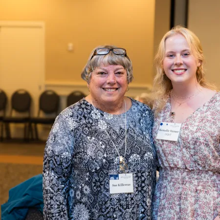 a couple of women smiling