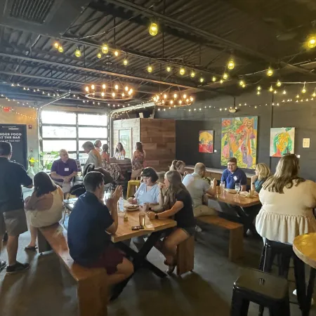 a group of people sitting at tables