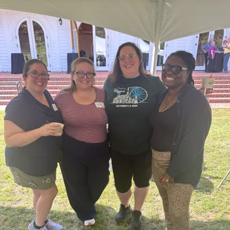 a group of women posing for a photo